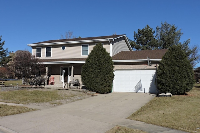 view of front of house featuring a garage, a front lawn, and a porch