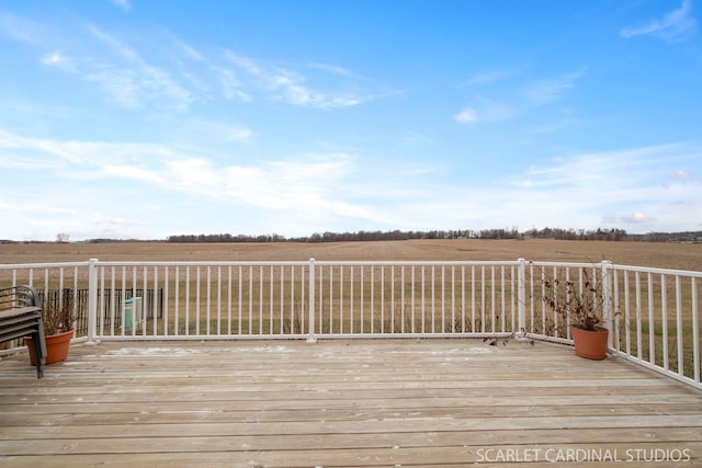 wooden terrace with a rural view