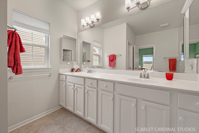 bathroom featuring tile patterned flooring and vanity