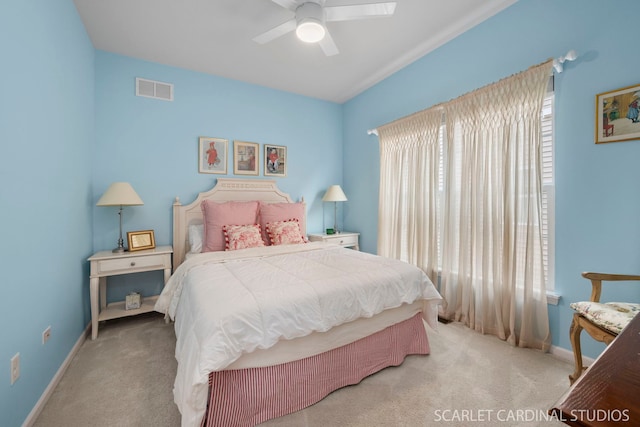 bedroom featuring ceiling fan and light carpet