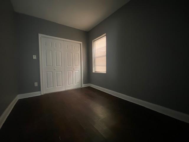 unfurnished bedroom featuring a closet