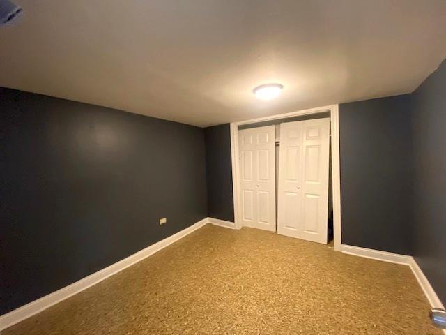 unfurnished bedroom with a closet