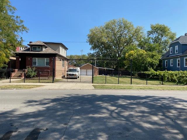 view of home's exterior with a garage and an outdoor structure