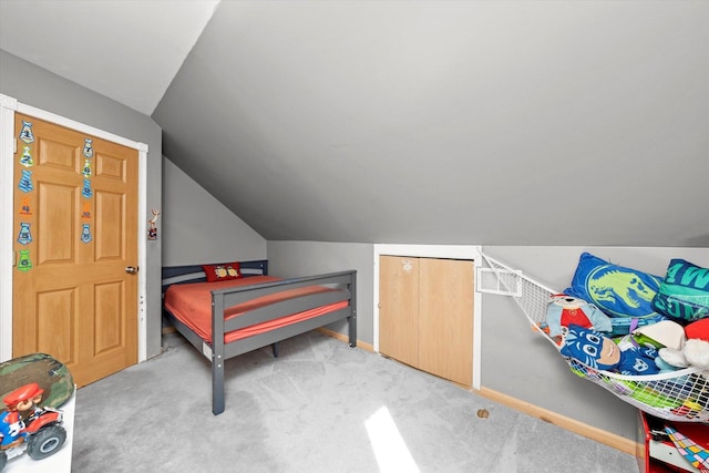 bedroom with baseboards, carpet flooring, and vaulted ceiling