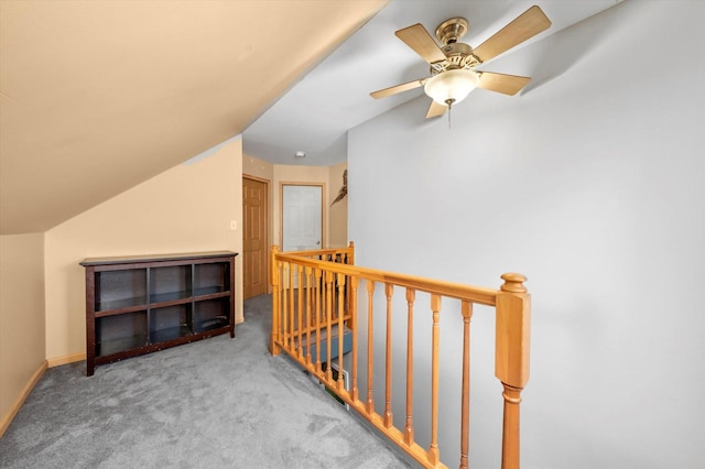 bonus room featuring lofted ceiling, baseboards, and carpet floors