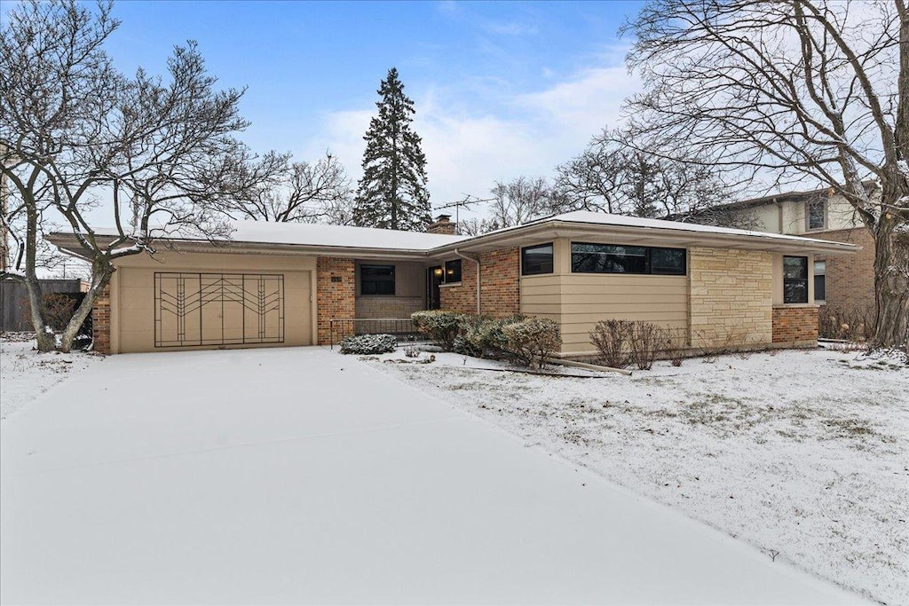 ranch-style home featuring a garage