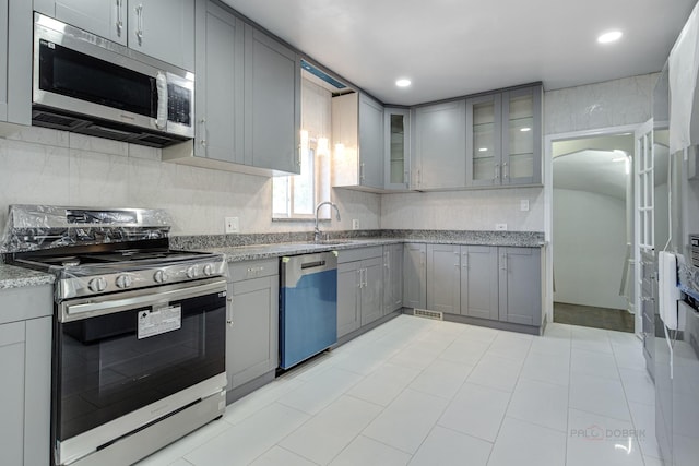 kitchen featuring gray cabinets and stainless steel appliances