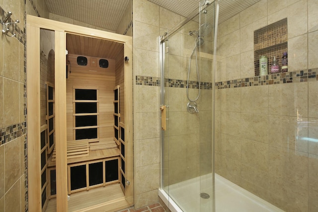 bathroom featuring a shower with shower door