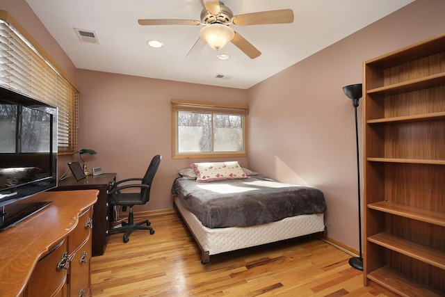 bedroom with ceiling fan and light hardwood / wood-style flooring