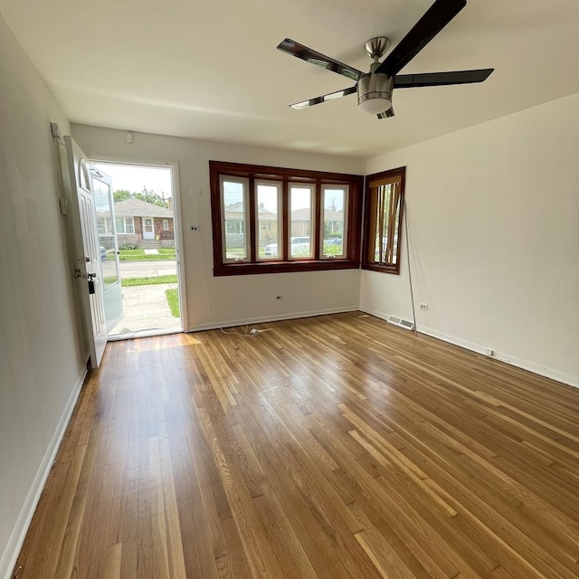 unfurnished room featuring hardwood / wood-style flooring and ceiling fan