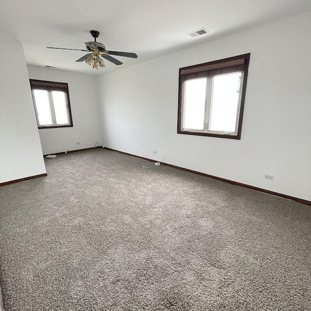 unfurnished room with ceiling fan and carpet floors