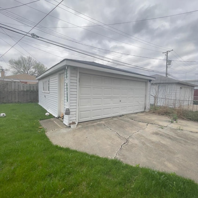 garage featuring a lawn