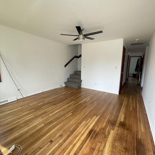 unfurnished living room with hardwood / wood-style floors and ceiling fan