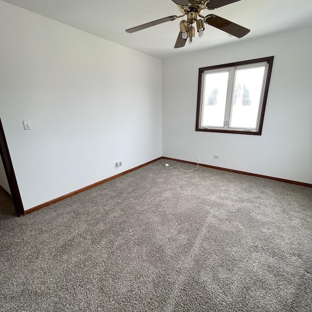 spare room with carpet flooring and ceiling fan