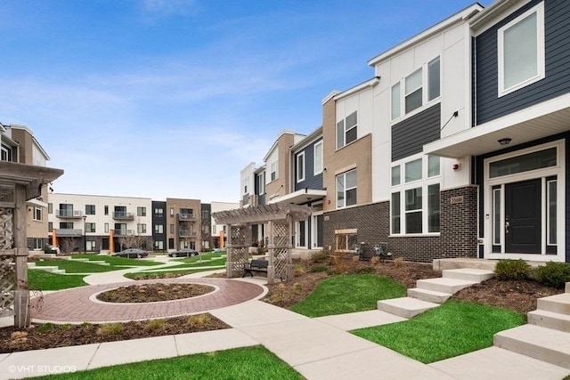 view of home's community featuring a pergola