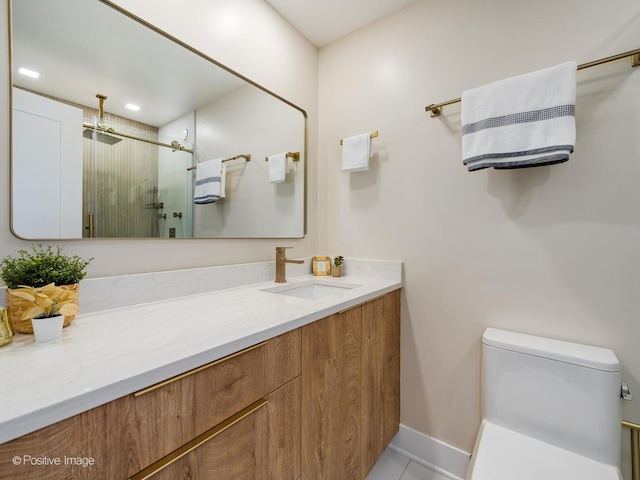 bathroom with toilet, a shower with door, vanity, and tile patterned flooring