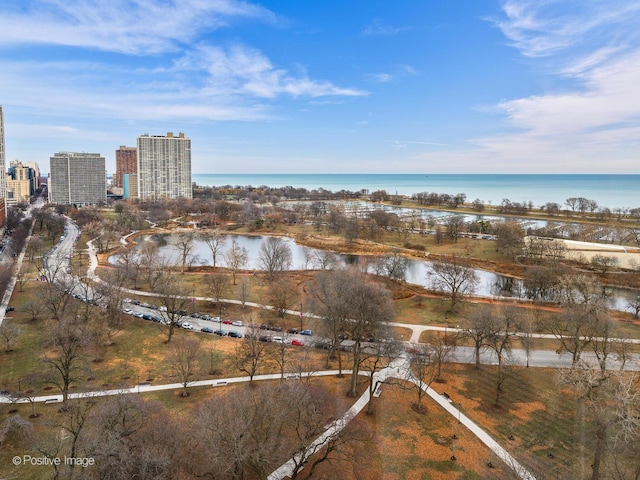 birds eye view of property with a water view