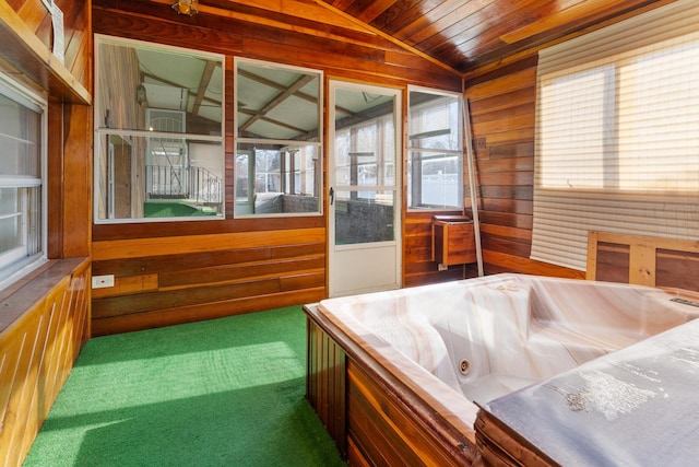 interior space featuring lofted ceiling, wooden ceiling, and a hot tub