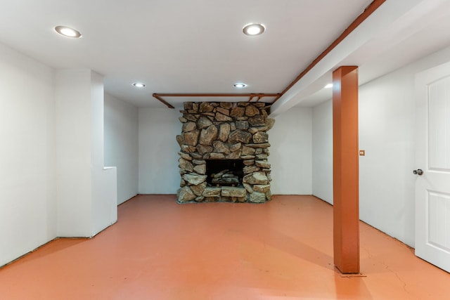 unfurnished living room featuring a fireplace and concrete floors