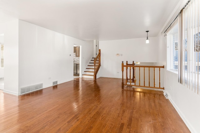 empty room featuring wood-type flooring