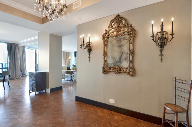 hallway with dark parquet floors and ornamental molding