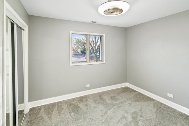 unfurnished bedroom with carpet floors and a closet