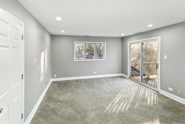 unfurnished room featuring carpet flooring