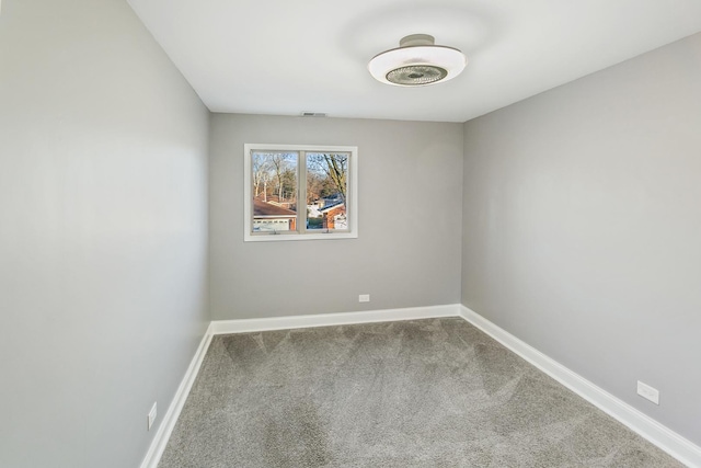 spare room featuring carpet flooring