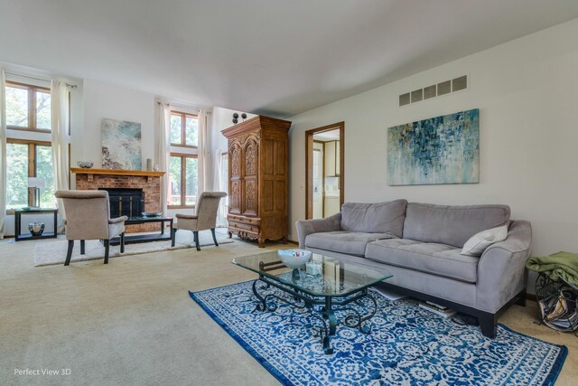 carpeted living room featuring a fireplace