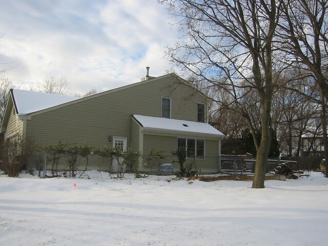 view of snow covered house