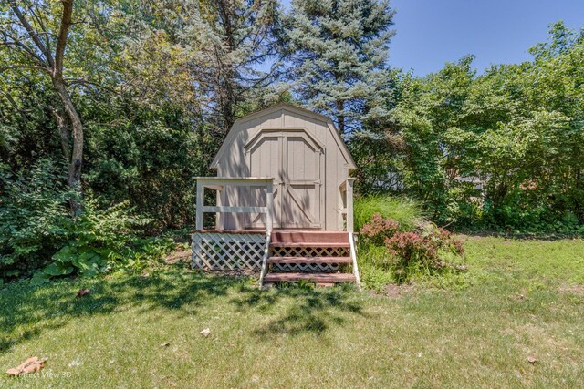 view of outbuilding with a lawn