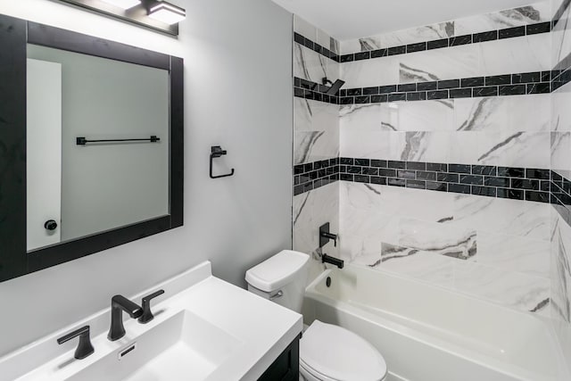 full bathroom with toilet, tiled shower / bath combo, and vanity