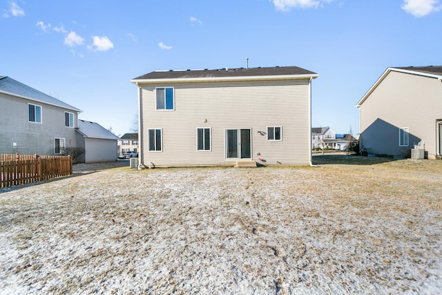 rear view of property featuring central air condition unit