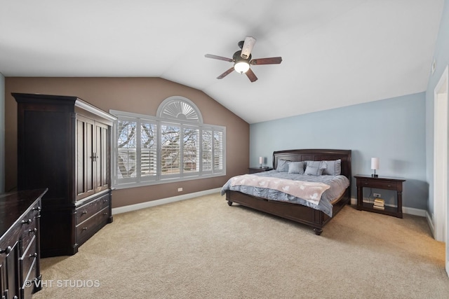 bedroom featuring ceiling fan, light colored carpet, and lofted ceiling