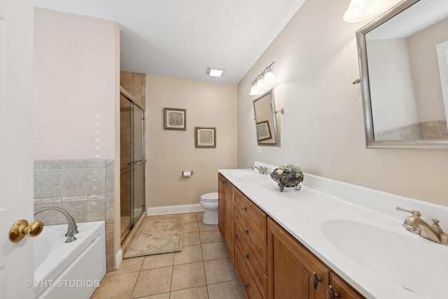 full bathroom with toilet, vanity, tile patterned floors, and separate shower and tub