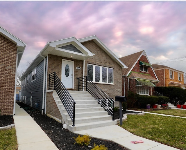 view of front of property with a yard