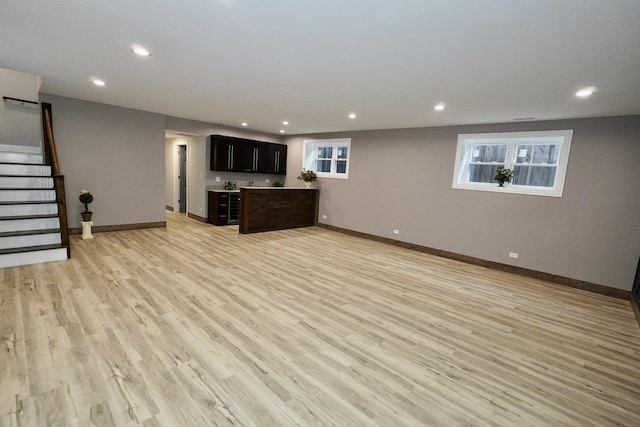 unfurnished living room with light hardwood / wood-style floors