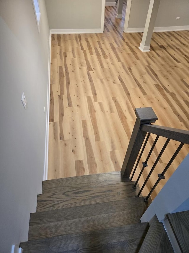 stairs with wood-type flooring