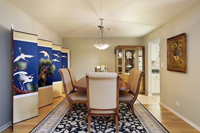 dining room with light hardwood / wood-style flooring