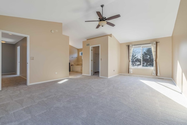 unfurnished living room featuring lofted ceiling, light colored carpet, and ceiling fan