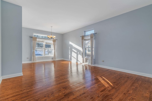 interior space featuring hardwood / wood-style flooring and a chandelier