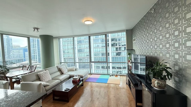 living room featuring hardwood / wood-style floors and expansive windows