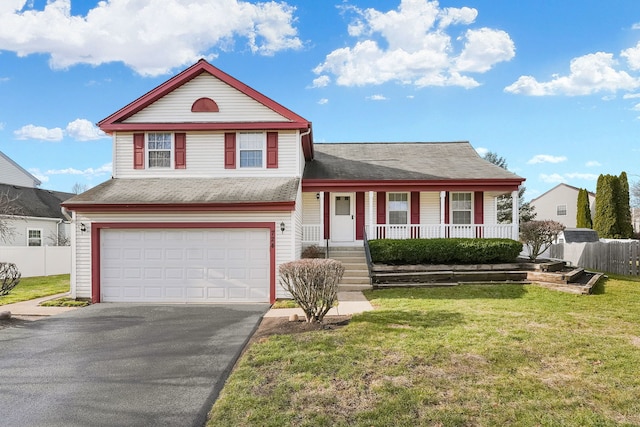 view of front of property with covered porch, a garage, and a front lawn