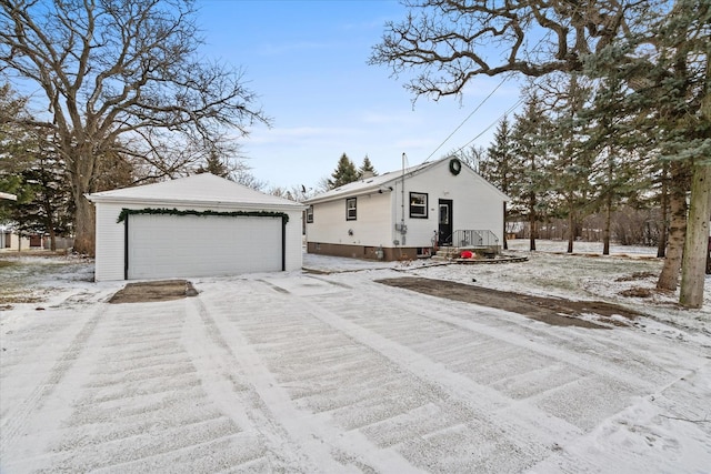 view of front of home with an outdoor structure and a garage