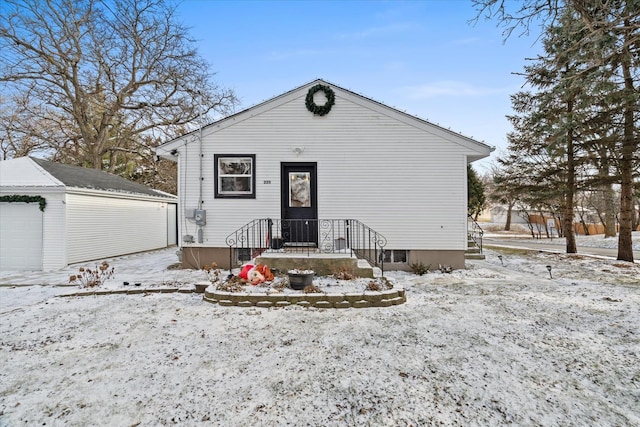 bungalow with an outbuilding and a garage