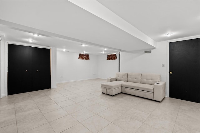 unfurnished living room with light tile patterned floors