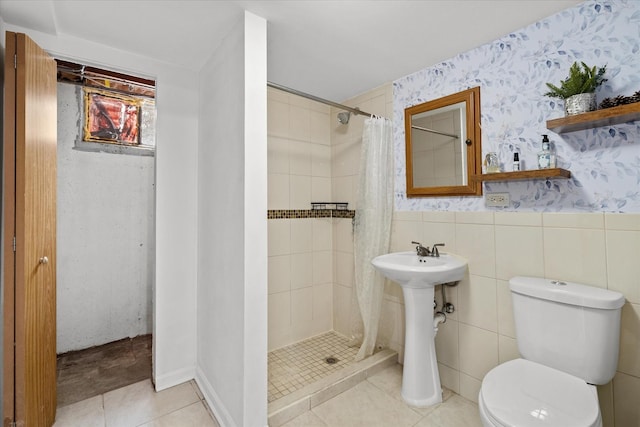 bathroom with toilet, tile patterned flooring, and walk in shower