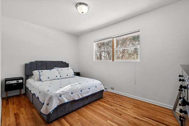 bedroom with wood-type flooring