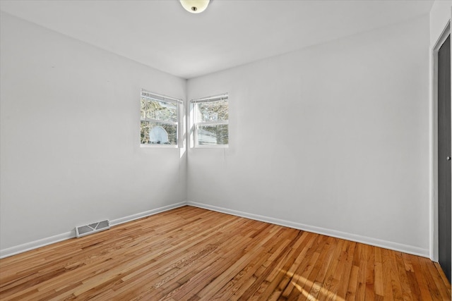 spare room featuring light hardwood / wood-style flooring