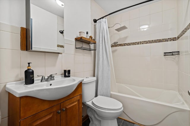 full bathroom featuring backsplash, tile walls, toilet, vanity, and shower / tub combo